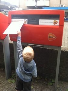 Boy posting a letter